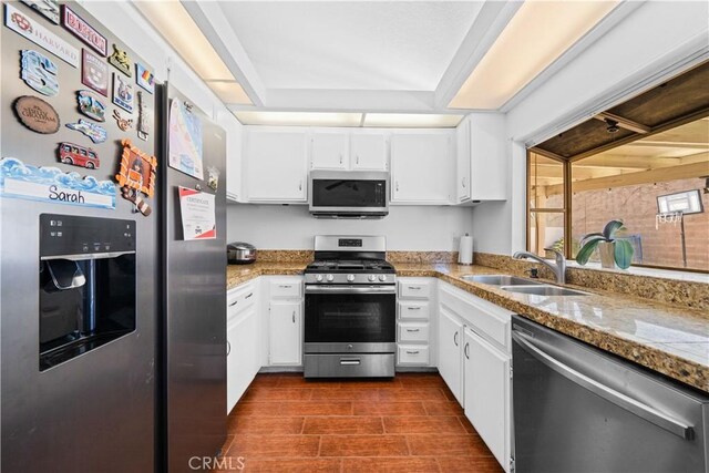 11571 Pinnacle Peak Ct, Rancho Cucamonga, CA 91737 - kitchen with appliances with stainless steel finishes, white cabinets, and light countertops