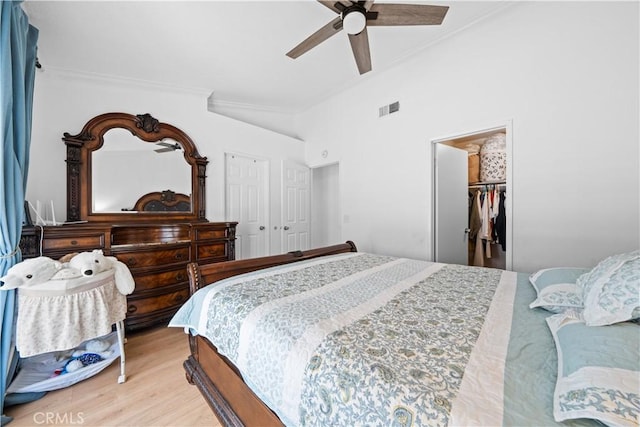 11571 Pinnacle Peak Ct, Rancho Cucamonga, CA 91737 - bedroom featuring crown molding, light wood finished floors, a closet, and a ceiling fan
