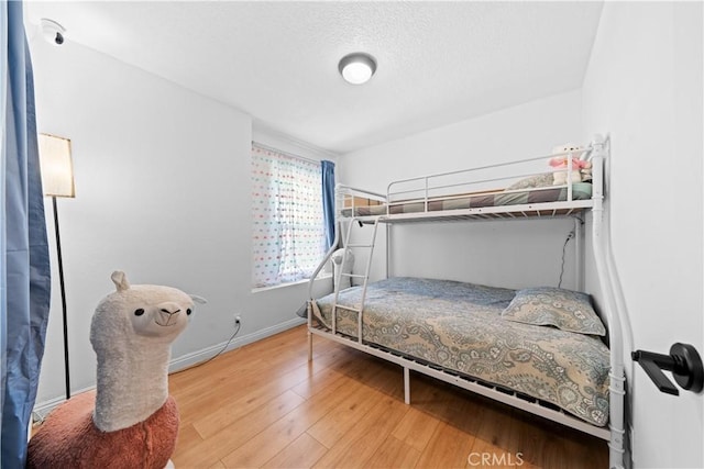 11571 Pinnacle Peak Ct, Rancho Cucamonga, CA 91737 - bedroom with wood finished floors and a textured ceiling