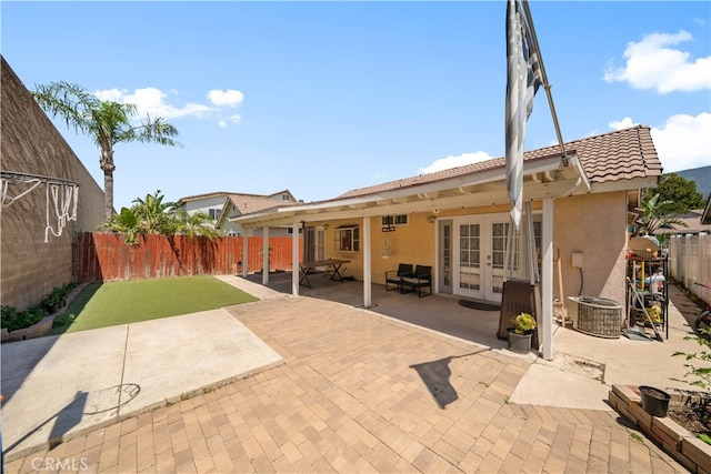11571 Pinnacle Peak Ct, Rancho Cucamonga, CA 91737 - back of house with french doors, stucco siding, and a fenced backyard