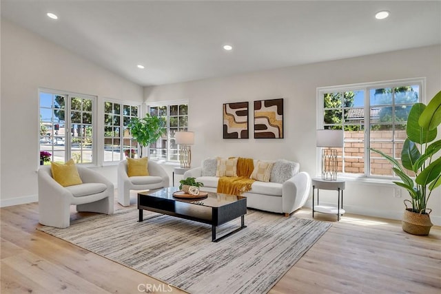 14181 Moore Ct, Irvine, CA 92606 - living area with wood finished floors, recessed lighting, and vaulted ceiling