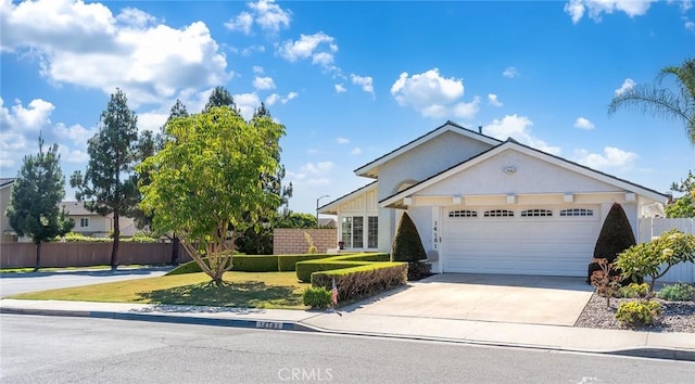 14181 Moore Ct, Irvine, CA 92606 - view of front of property with a garage, stucco siding, and driveway