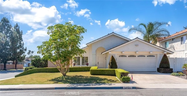 14181 Moore Ct, Irvine, CA 92606 - view of front facade with an attached garage, driveway, and stucco siding