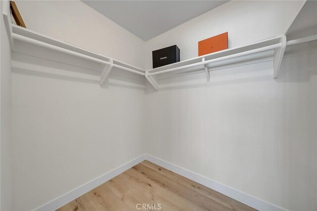 14181 Moore Ct, Irvine, CA 92606 - spacious closet featuring wood finished floors