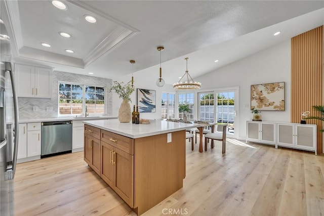 14181 Moore Ct, Irvine, CA 92606 - kitchen featuring appliances with stainless steel finishes, light wood-type flooring, decorative backsplash, white cabinetry, and recessed lighting
