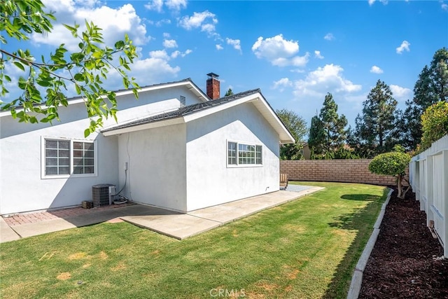 14181 Moore Ct, Irvine, CA 92606 - view of property exterior featuring a fenced backyard, a patio, a chimney, and stucco siding