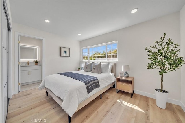 14181 Moore Ct, Irvine, CA 92606 - bedroom with light wood finished floors and recessed lighting