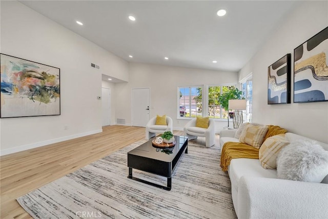14181 Moore Ct, Irvine, CA 92606 - living room with wood finished floors, recessed lighting, and vaulted ceiling