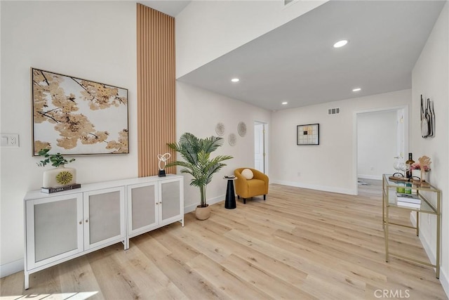 14181 Moore Ct, Irvine, CA 92606 - sitting room with light wood-style floors and recessed lighting