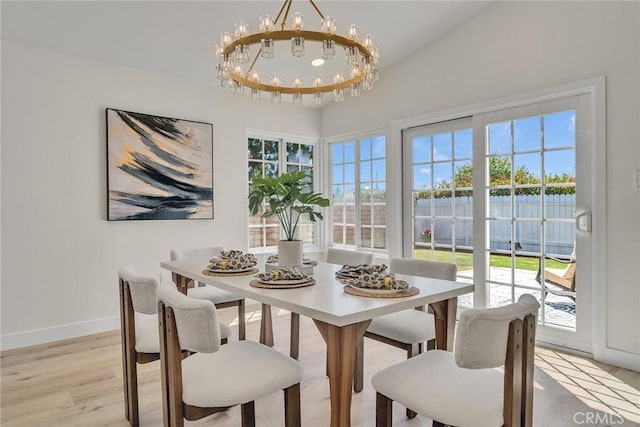 14181 Moore Ct, Irvine, CA 92606 - dining area with a chandelier, light wood finished floors, and plenty of natural light