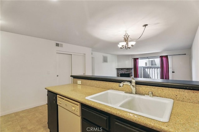 8544 Independence Ave Unit 102, Canoga Park, CA 91304 - kitchen featuring dishwasher, a chandelier, decorative light fixtures, and light countertops