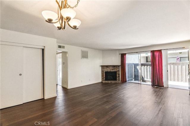 8544 Independence Ave Unit 102, Canoga Park, CA 91304 - unfurnished living room with a chandelier, dark wood-type flooring, and a fireplace