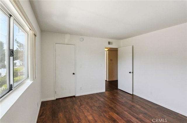 8544 Independence Ave Unit 102, Canoga Park, CA 91304 - unfurnished bedroom with wood finished floors and baseboards