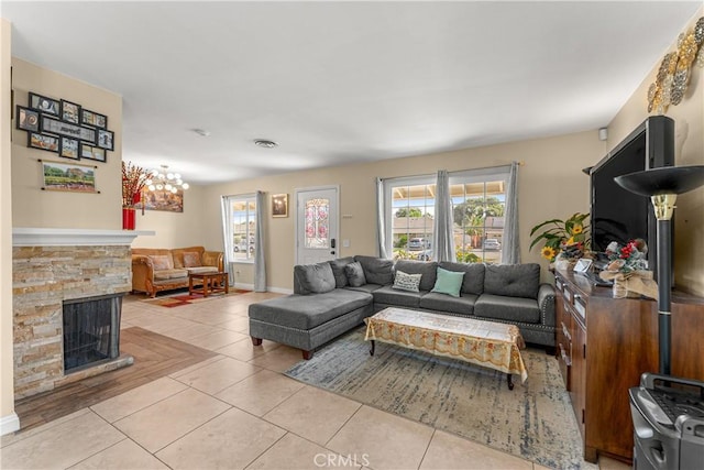 404 Atwood Dr, Corona, CA 92879 - living room featuring healthy amount of natural light, light tile patterned floors, and a stone fireplace