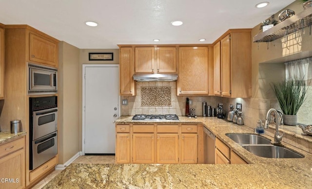 1501 Devonshire Dr, Oxnard, CA 93030 - kitchen featuring appliances with stainless steel finishes, light stone counters, under cabinet range hood, tasteful backsplash, and recessed lighting