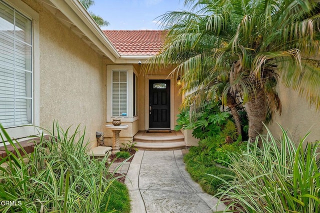 1501 Devonshire Dr, Oxnard, CA 93030 - property entrance with stucco siding and a tiled roof