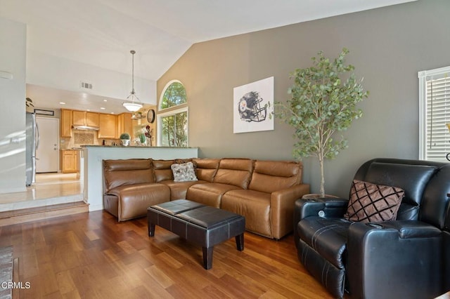 1501 Devonshire Dr, Oxnard, CA 93030 - living room featuring light wood-type flooring and high vaulted ceiling