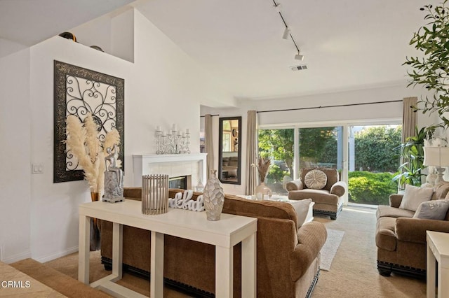 1501 Devonshire Dr, Oxnard, CA 93030 - carpeted living room featuring rail lighting and a fireplace