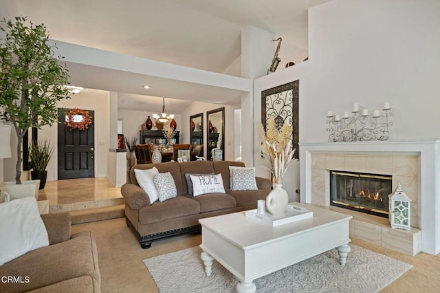 1501 Devonshire Dr, Oxnard, CA 93030 - living area featuring lofted ceiling, carpet flooring, a fireplace, and a chandelier