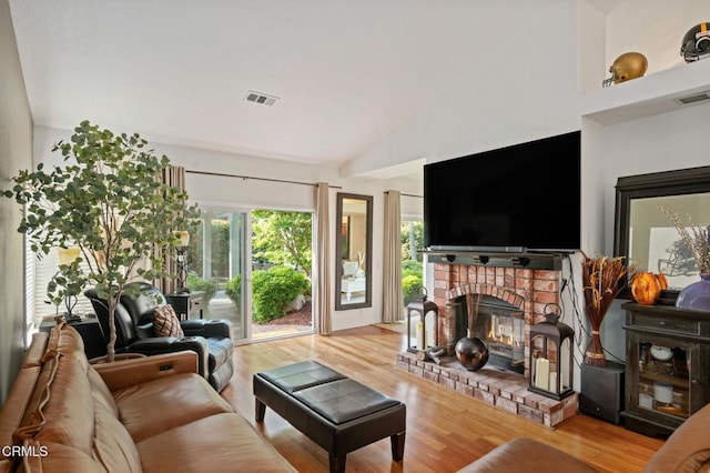 1501 Devonshire Dr, Oxnard, CA 93030 - living area featuring wood finished floors, a fireplace, and high vaulted ceiling