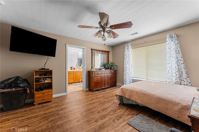 1447 White Cloud Ln, Beaumont, CA 92223 - bedroom with wood finished floors, ensuite bath, and ceiling fan