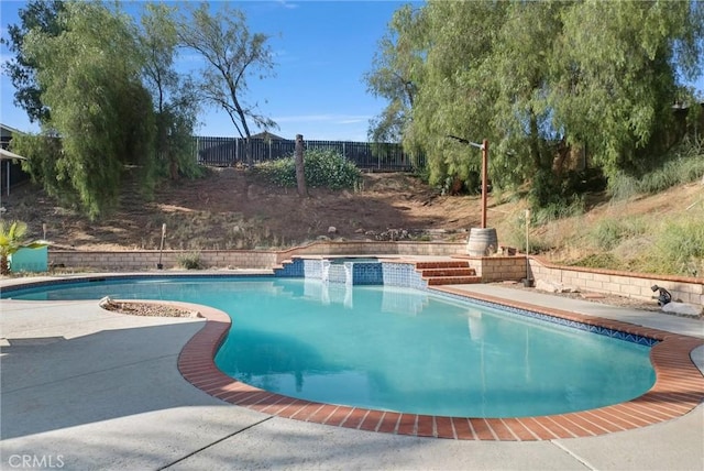 12312 Marmont Pl, Moreno Valley, CA 92557 - view of swimming pool with a pool with connected hot tub