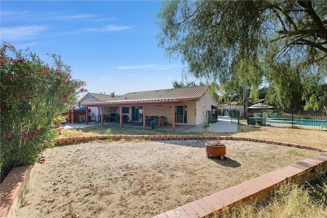 12312 Marmont Pl, Moreno Valley, CA 92557 - rear view of house featuring an outdoor fire pit, a patio area, and stucco siding