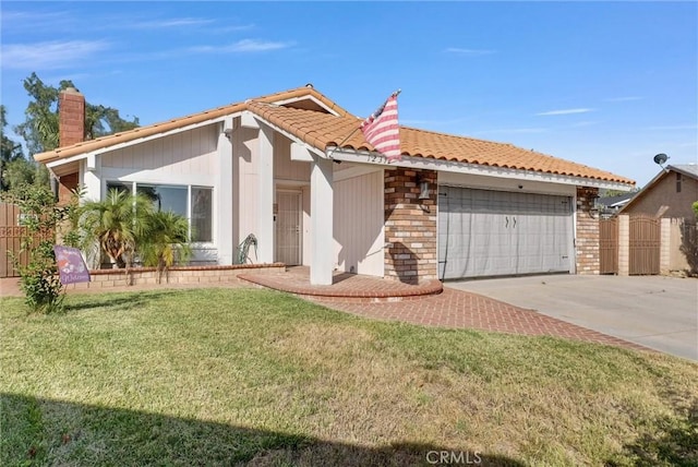12312 Marmont Pl, Moreno Valley, CA 92557 - ranch-style home featuring a garage, a tiled roof, driveway, and a chimney
