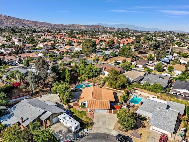 12312 Marmont Pl, Moreno Valley, CA 92557 - aerial perspective of suburban area with a pool area and a mountain backdrop