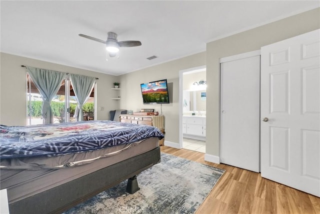 12312 Marmont Pl, Moreno Valley, CA 92557 - bedroom with wood finished floors, ensuite bathroom, and ceiling fan