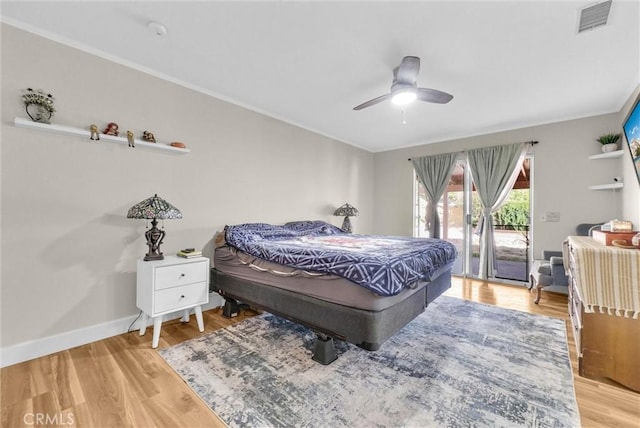 12312 Marmont Pl, Moreno Valley, CA 92557 - bedroom featuring access to exterior, crown molding, wood finished floors, and a ceiling fan