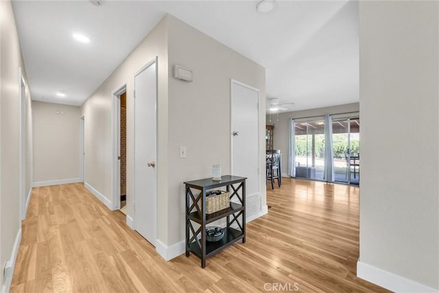12312 Marmont Pl, Moreno Valley, CA 92557 - hall with light wood-type flooring and baseboards