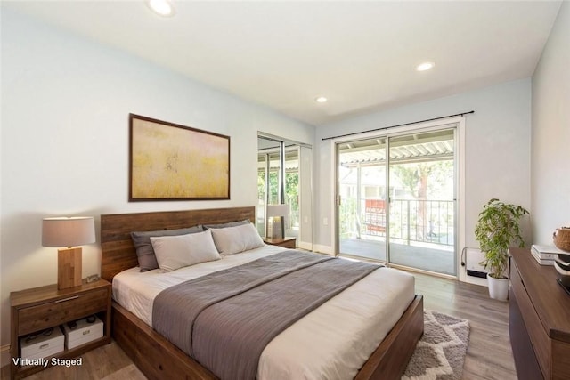 811 Ronda Mendoza Unit P, Laguna Woods, CA 92637 - bedroom with access to exterior, light wood-style flooring, and recessed lighting