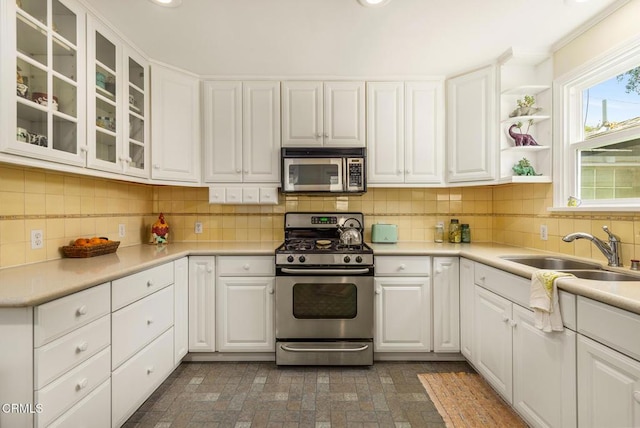 840 Fairview Rd, Ojai, CA 93023 - kitchen with stainless steel appliances, white cabinetry, glass insert cabinets, and recessed lighting