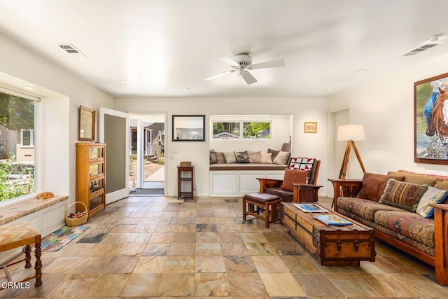 840 Fairview Rd, Ojai, CA 93023 - living room featuring a ceiling fan and stone tile floors