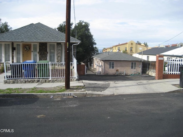 10145 Mountair Ave, Tujunga, CA 91042 - view of front facade featuring a porch and stone siding