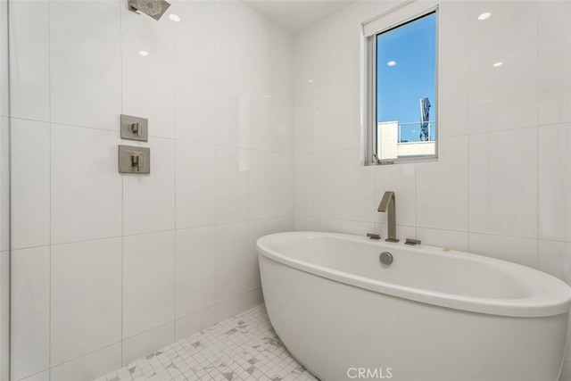 3306 Via Oporto, Newport Beach, CA 92663 - bathroom with tile walls, a soaking tub, and tile patterned floors