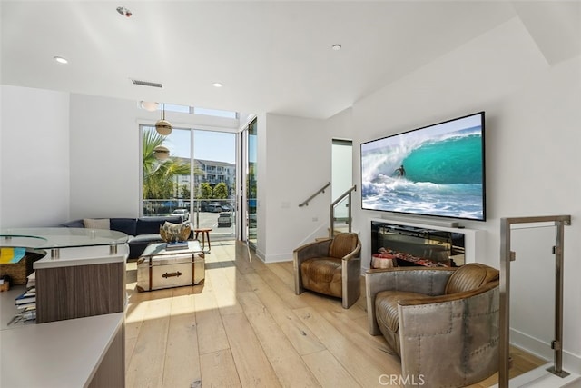 3306 Via Oporto, Newport Beach, CA 92663 - living room featuring light wood-type flooring, stairway, expansive windows, and recessed lighting