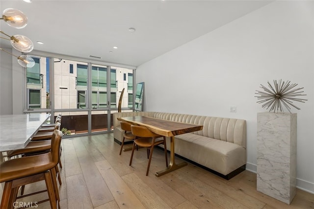 3306 Via Oporto, Newport Beach, CA 92663 - dining space featuring expansive windows, wood-type flooring, and recessed lighting