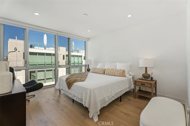 3306 Via Oporto, Newport Beach, CA 92663 - bedroom featuring hardwood / wood-style flooring, a wall of windows, and recessed lighting