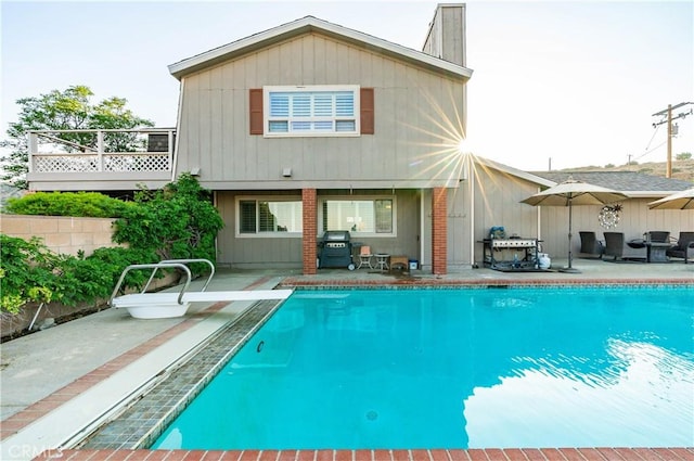35870 Tierra Subida Ave, Palmdale, CA 93551 - back of property with a patio, an outdoor pool, and a chimney