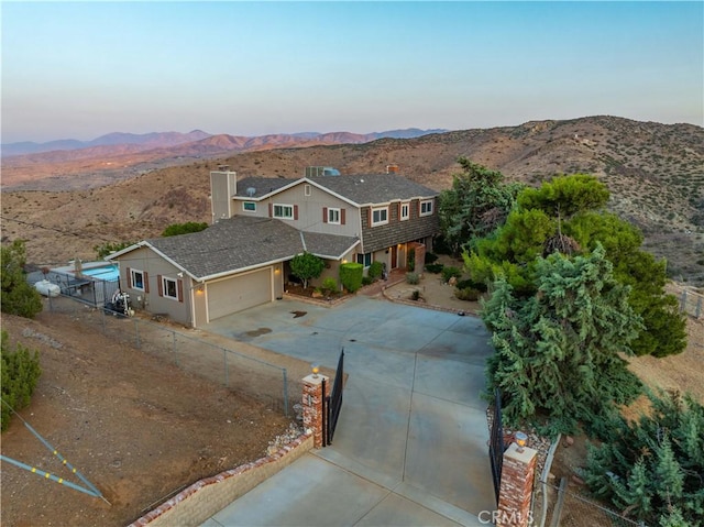 35870 Tierra Subida Ave, Palmdale, CA 93551 - view of front of property featuring driveway, a mountain view, a garage, and roof with shingles