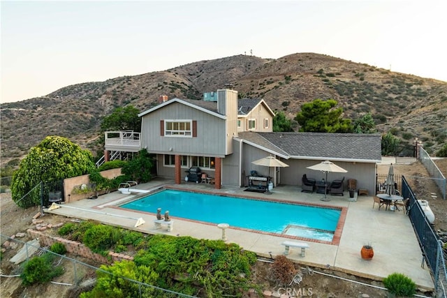 35870 Tierra Subida Ave, Palmdale, CA 93551 - view of pool featuring a diving board, a fenced backyard, a mountain view, and a patio
