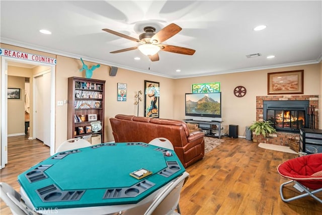 35870 Tierra Subida Ave, Palmdale, CA 93551 - playroom with a ceiling fan, wood finished floors, ornamental molding, a fireplace, and recessed lighting