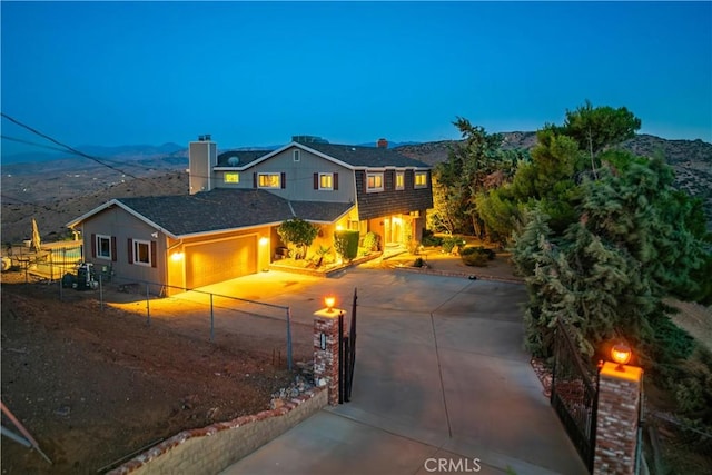 35870 Tierra Subida Ave, Palmdale, CA 93551 - traditional-style home with a garage, a chimney, concrete driveway, and a mountain view