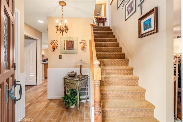 35870 Tierra Subida Ave, Palmdale, CA 93551 - stairs featuring a chandelier, wood finished floors, and recessed lighting