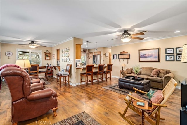 35870 Tierra Subida Ave, Palmdale, CA 93551 - living area featuring a ceiling fan, crown molding, wood finished floors, and recessed lighting