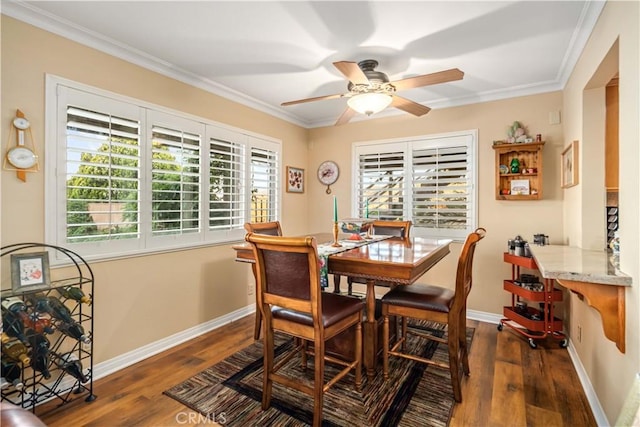 35870 Tierra Subida Ave, Palmdale, CA 93551 - dining space featuring dark wood finished floors, a ceiling fan, and ornamental molding