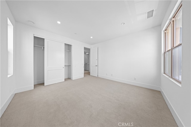 312 Brimwood, Irvine, CA 92618 - unfurnished bedroom featuring light carpet, a closet, and recessed lighting