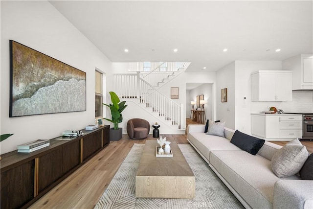 312 Brimwood, Irvine, CA 92618 - living room with light wood-style floors, recessed lighting, and stairs